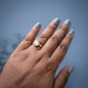 Woman wearing Round Halo CZ Solitaire Ring in gold plated finish with sparkling white stone by House of Viya