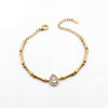 Gold Plated Bamboo Bar Link Bracelet with Side Oval White Stone Halo Accent and Lobster Clasp