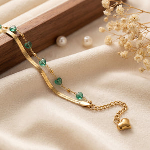 Close-up of Anti-Tarnish Gold Plated Snake Chain Bracelet with green aura beads and heart charm - House of Viya