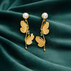 Anti-Tarnish Gold Plated Hanging Half Butterfly Earrings by House of Viya on green fabric background