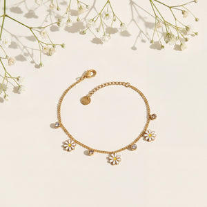 Gold Plated Curb Chain Bracelet with Dangling White Enamel Daisy Flower Charms and Stone Accents