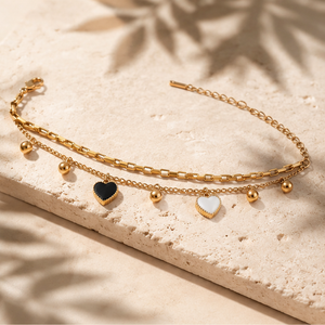 Gold Plated Double Layer Bead Chain Bracelet with Black and White Dangling Heart Charm Drops