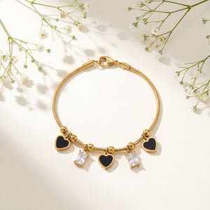 Gold Plated Snake Chain Bracelet with Black Heart and Square Baguette Stone Dangling Charms