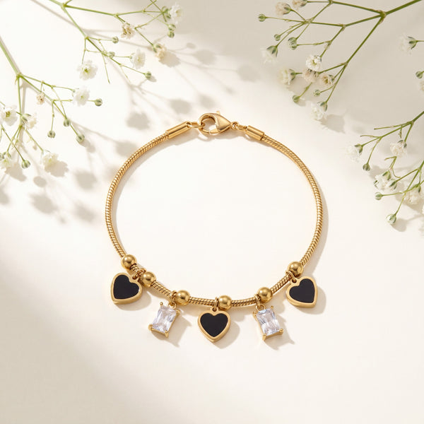 Gold Plated Snake Chain Bracelet with Black Heart and Square Baguette Stone Dangling Charms