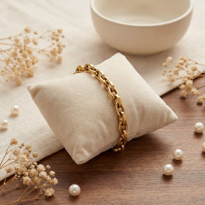 Anti-Tarnish Gold Plated Viya Royal Link Bracelet by House of Viya on beige cushion with pearls and dried flowers