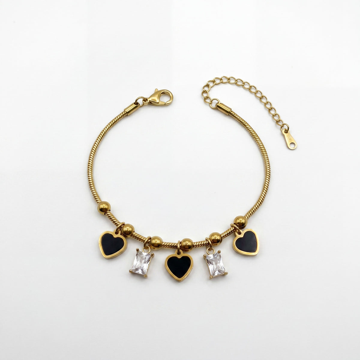 Gold Plated Snake Chain Bracelet with Black Heart and Square Baguette Stone Dangling Charms