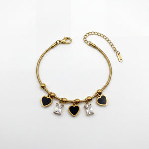 Gold Plated Snake Chain Bracelet with Black Heart and Square Baguette Stone Dangling Charms