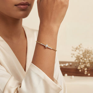 Woman wearing Anti-Tarnish Gold Plated Celeste Interlocked Cylinder CZ Bracelet on wrist - House of Viya