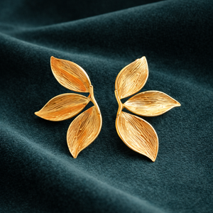 Anti-Tarnish Gold Plated Hanging Half Flower Earrings by House of Viya on dark fabric background