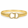 Gold CD Logo Initials Ribbed Twisted Band Oval Kada for Women | Monogram Designer Stainless Steel Ladies Bangle | Luxury Brand Festive Jewellery