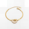 Gold Plated Snake Chain Bracelet with Crescent Moon Mother of Pearl Charm and Floral Star Accent