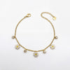Gold Plated Curb Chain Bracelet with Dangling White Enamel Daisy Flower Charms and Stone Accents