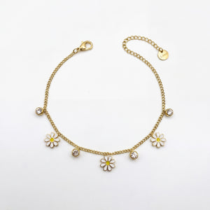 Gold Plated Curb Chain Bracelet with Dangling White Enamel Daisy Flower Charms and Stone Accents