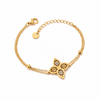 Gold Plated Delicate Chain Bracelet with Twin Filigree Quatrefoil Clover Charm Center and Lobster Clasp
