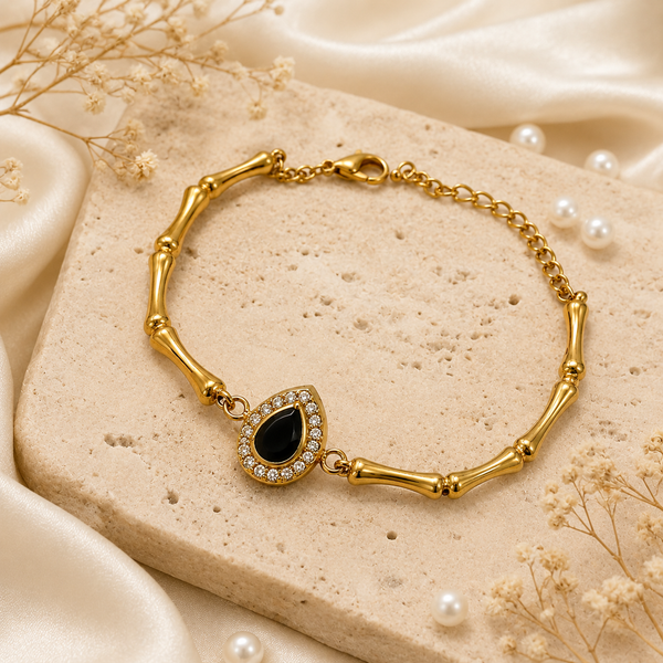 Gold Plated Bamboo Bar Link Bracelet with Oval Black Stone Halo Centrepiece and Lobster Clasp