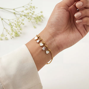 Gold Plated Snake Chain Bracelet with White Heart and Square Baguette Stone Dangling Charms