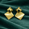 Anti-Tarnish Gold Plated Gold Stud with Gold Square Earrings by House of Viya on green fabric background