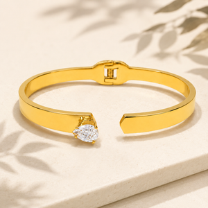 Gold Hinged Pear Solitaire Diamond Oval Kada for Women | Single Teardrop Stone Stainless Steel Ladies Bangle | Statement Festive Jewellery