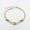 Gold Plated Double Strand Snake Chain Bracelet with Polished Bead Station Accents and Lobster Clasp