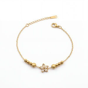 Gold Plated Beaded Stretch Bracelet with White Stone Floral Star Charm