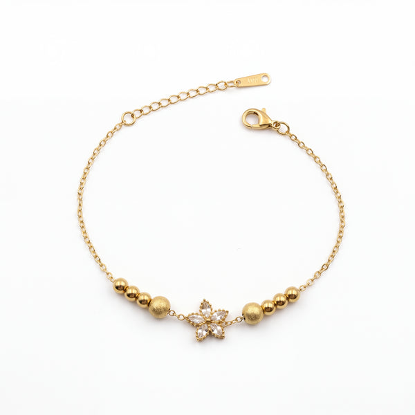 Gold Plated Beaded Stretch Bracelet with White Stone Floral Star Charm
