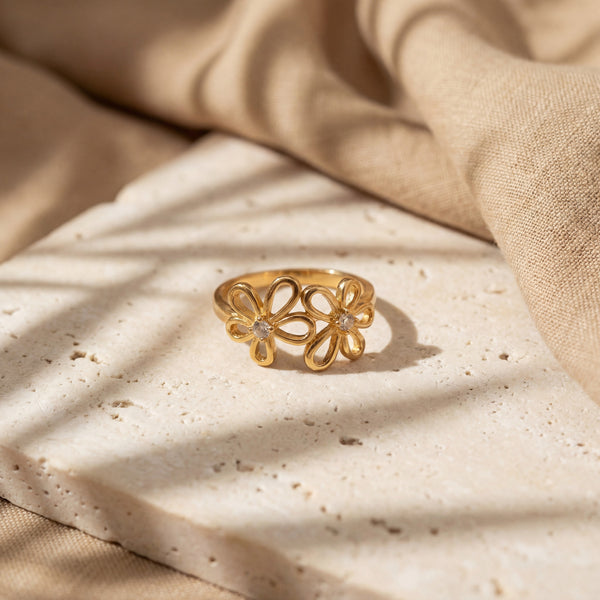 House of Viya Double Flower Butterfly Open Ring – Gold Plated White CZ Bloom Statement Ring for Women, front view on fabric